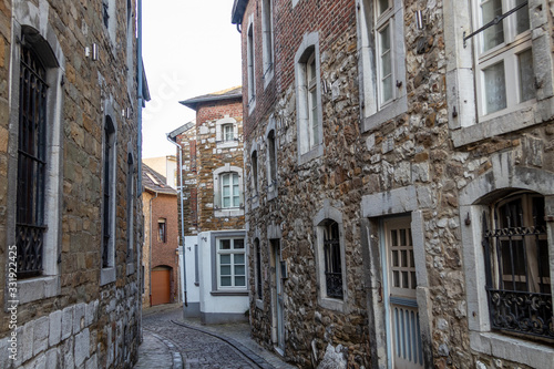 Narrow road with cobblestone pavement and historic buildings in Stolberg  Eifel
