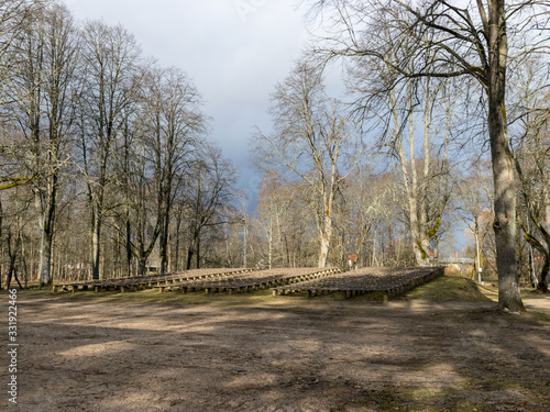 landscape with rows of wooden benches in the park © ANDA