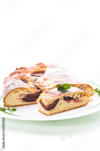 sweet baked homemade plum cake with icing sugar