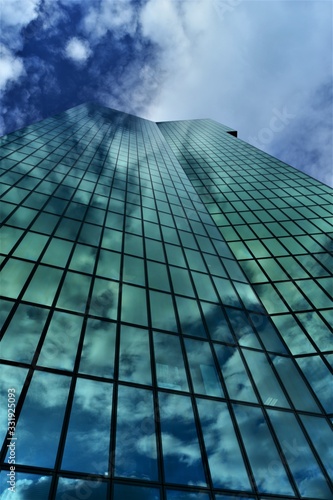 glass facade reflected in the clouds