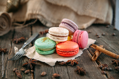 Fotografija Coloured sweet macaron dessert  on the wooden table