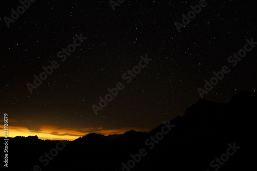 Silhouette of mountains in the Swiss mountain landscape at sunrise