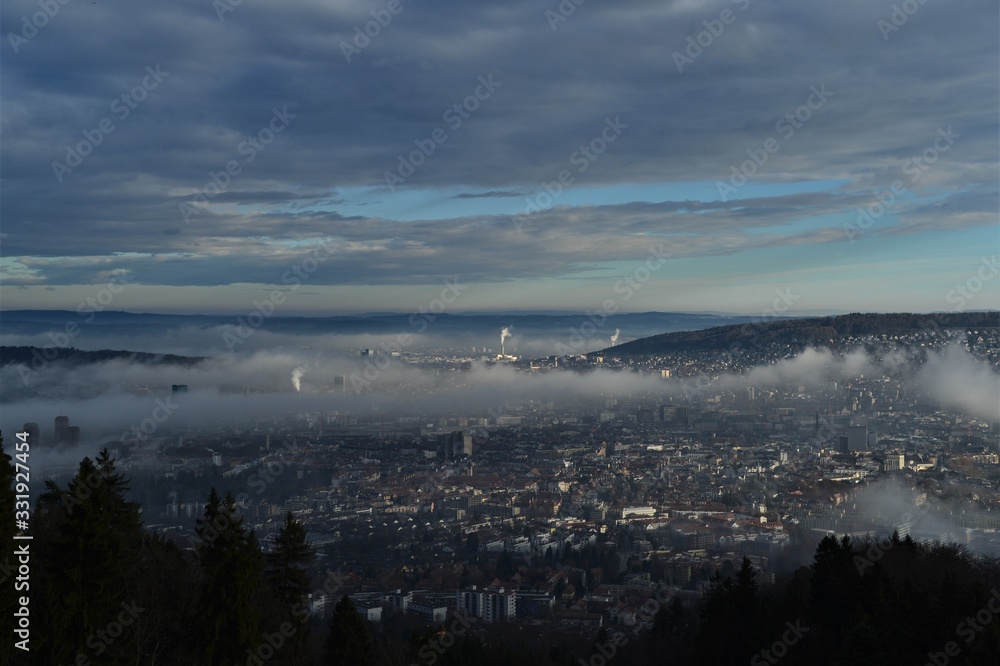 the city of zurich switzerland viewed from the uetliberg in the fog in the morning mood the city of zurich switzerland viewed from the uetliberg in the fog in the morning mood