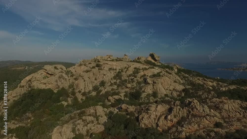 Scenic north Sardinia coast on summer day. Rugged granite rocky shoreline. View of Capo D'Orso rock formation, Palau and La Maddalena. Aerial view. Scenic north Sardinia coast on summer day. Rugged granite rocky shoreline. View of Capo D'Orso rock formation, Palau and La Maddalena. Aerial view.