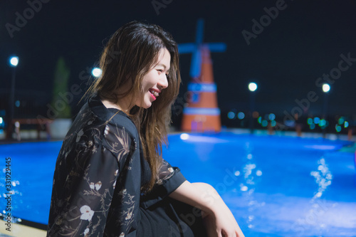 Beautiful young women with bright  black floral dresses.