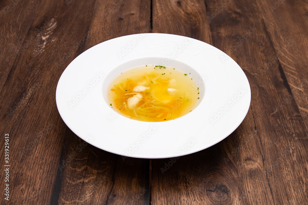 Chicken consomme with dumplings .
Chicken broth with chicken fillet dumplings and quail egg. Healthy dietary tasty food, homemade meals. A plate of Chicken broth. Chicken consomme with dumplings .
Chicken broth with chicken fillet dumplings and quail egg. Healthy dietary tasty food, homemade meals. A plate of Chicken broth.