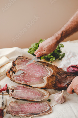 cutting out meat . boiled pork . smoked product . kitchen herbs