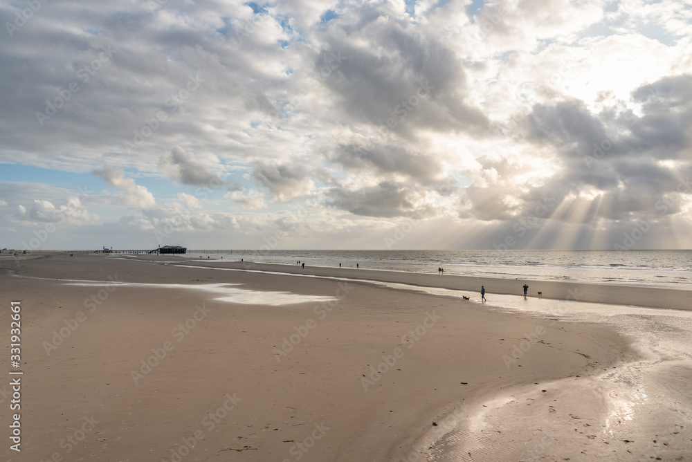 Beach of St Peter-Ording, stilt houses in background