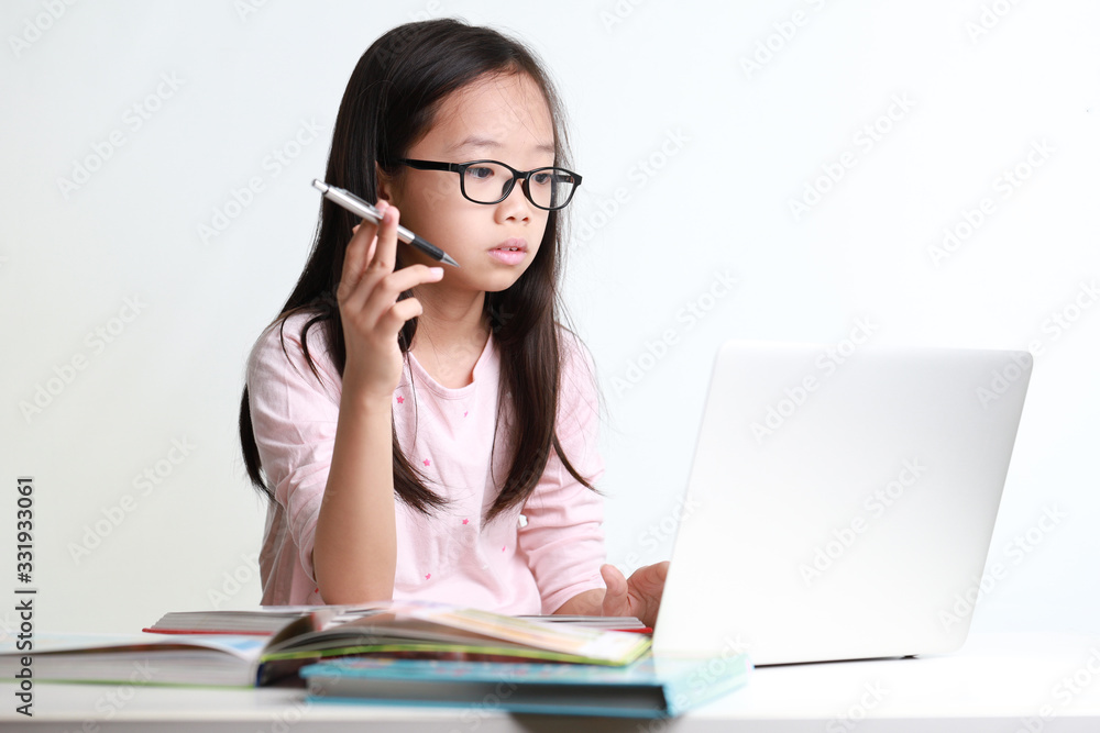 Portrait of attractive young asian girl using laptop isolated on white background Portrait of attractive young asian girl using laptop isolated on white background