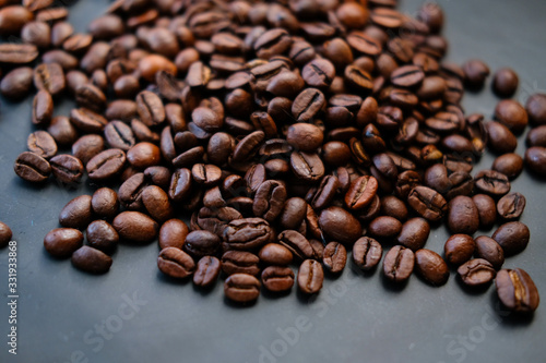 coffee beans are on a black background. © kristina