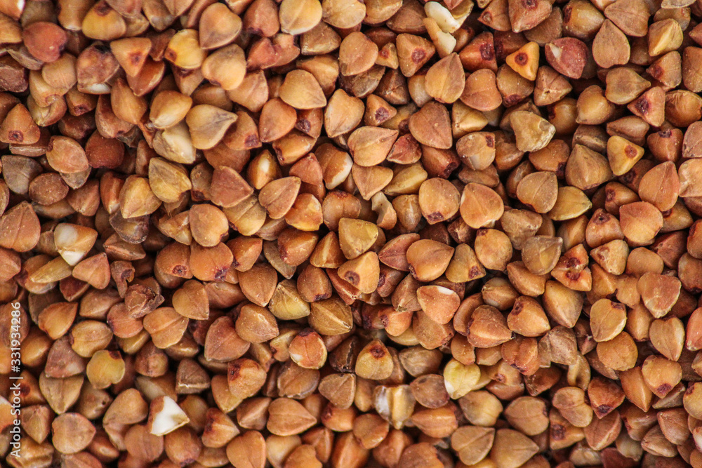 Buckwheat groats background. Close up. Macro. Healthy food, diet, natural product Buckwheat groats background. Close up. Macro. Healthy food, diet, natural product