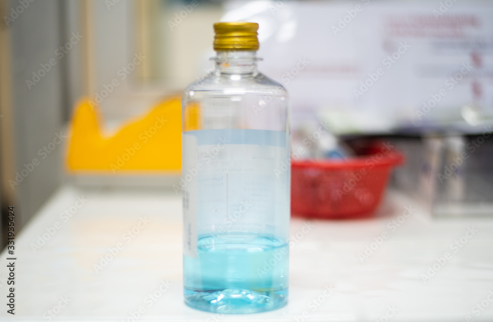 alcohol 70% on blur background with protected coronavirus. alcohol 70% on blur background with protected coronavirus.