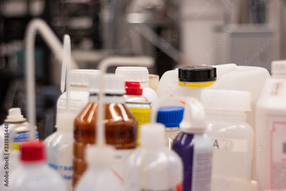 Various plastic bottle chemical containers in a science laboratory group shot shallow depth of field Various plastic bottle chemical containers in a science laboratory group shot shallow depth of field