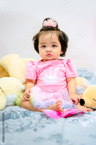 cute baby girl in a pink dress