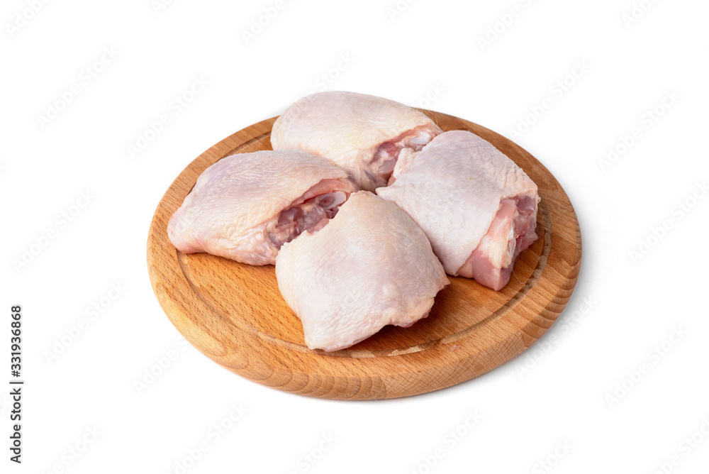Raw chicken thighs isolated on white background. Raw chicken thighs isolated on white background.