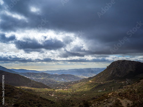 Dramatic landscape of mountains and valley and cloudy sky