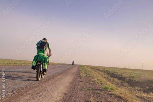 cyclist in green clothes, Southern Kazakhstan © velotabun