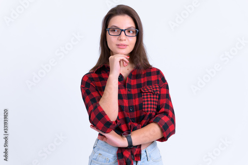 Portrait of young beautiful hipster woman thinking