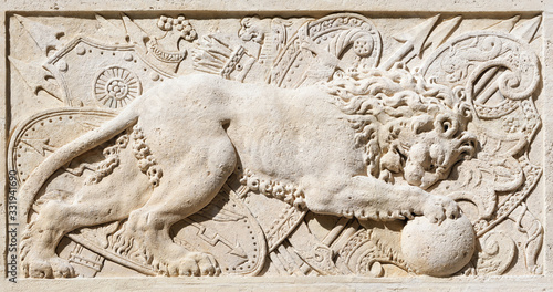 Relief with figure of Lion at entance of Hôtel Carnavalet in Paris, France photo