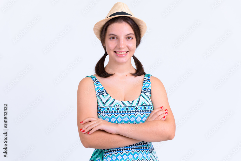 Portrait of young happy tourist woman smiling with arms crossed Portrait of young happy tourist woman smiling with arms crossed