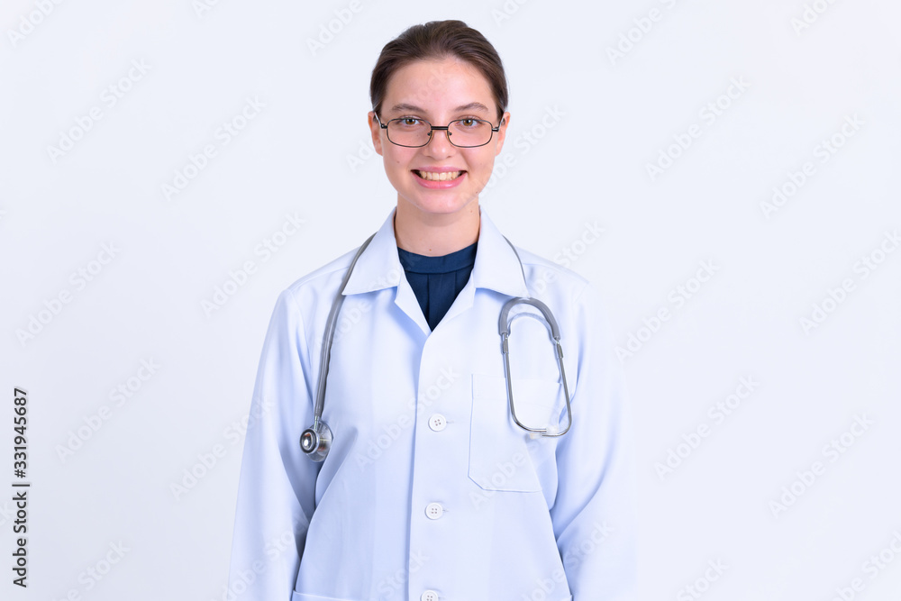 Portrait of young happy woman doctor with eyeglasses smiling