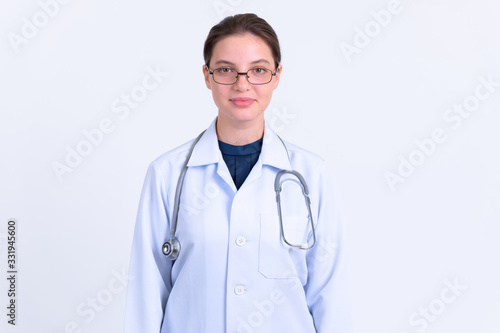 Portrait of young beautiful woman doctor with eyeglasses