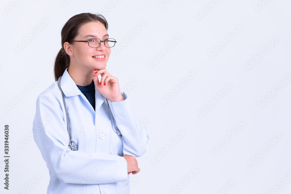 Portrait of happy young beautiful woman doctor thinking Portrait of happy young beautiful woman doctor thinking