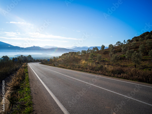 Road in mountain landscape in the morning in Andalucia, Spain