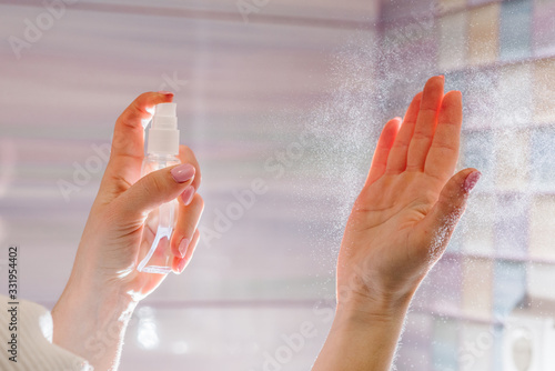Hands applying alcohol spray or anti bacteria spray. Personal hygiene concept. Coronavirus. Cleaning hands with sanitizer gel. Prevent the spread of germs and avoid infections coronavirus.