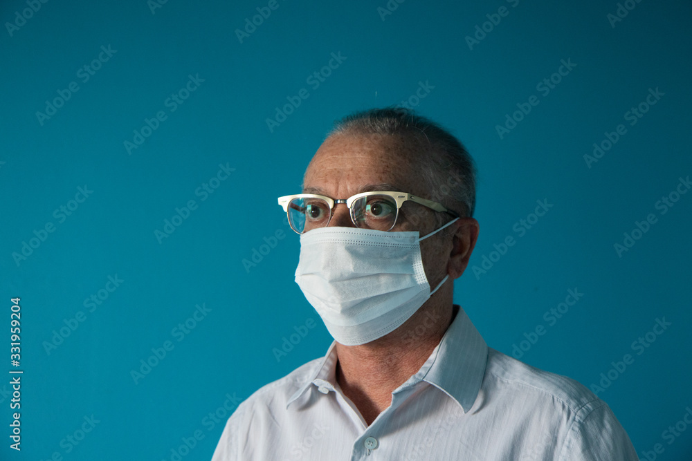 Recife / Pernambuco / Brazil. March, 20, 2020. Images of a 54-year-old middle-aged male model wearing protective hospital masks and gloves. Protection against Covid-19.
