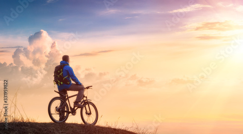 Cyclist on a mountain top