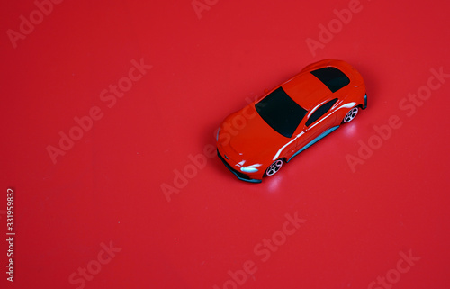 Red sports car Isolated on a red background.