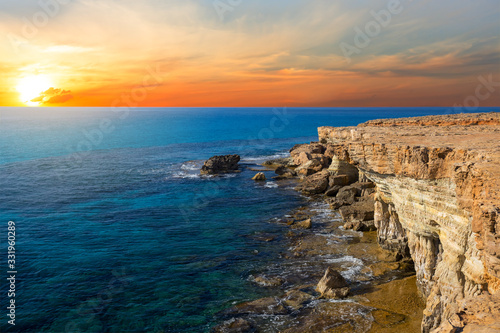 rocky sea bay coast at the sunset