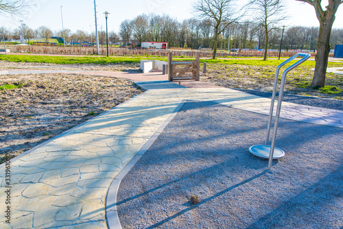 an exercise park. In the park, wheelchair users, walker users and elderly people with walking difficulties can go to exercise. different pavement on the ground. zeewolde netherlands flevoland 21 March photo