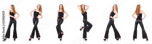 Redhead woman in black bell bottom pants on white