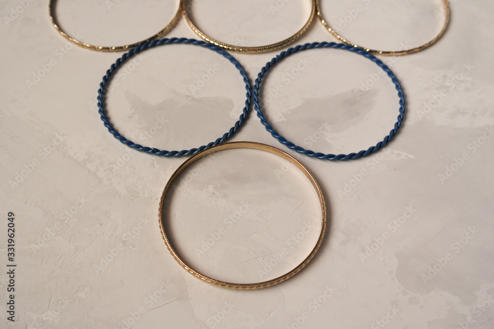 Round metal bracelets on a gray background Round metal bracelets on a gray background