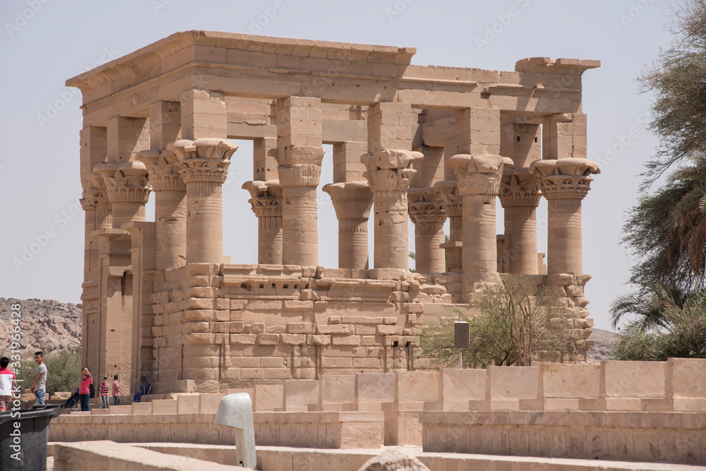 Trajan's kiosk next to the Temple of Philae on the Nile River, Aswan, Egypt, on Agilkia Island. Trajan's kiosk next to the Temple of Philae on the Nile River, Aswan, Egypt, on Agilkia Island.