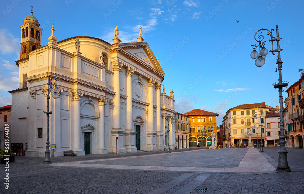 Bassano del grappa Italy, church saint John on freedom square. Deserted morning street with street lamp scenic landscape old town with blue sky.