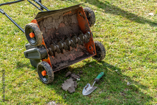 Clleaning a lawn thatcher in the garden