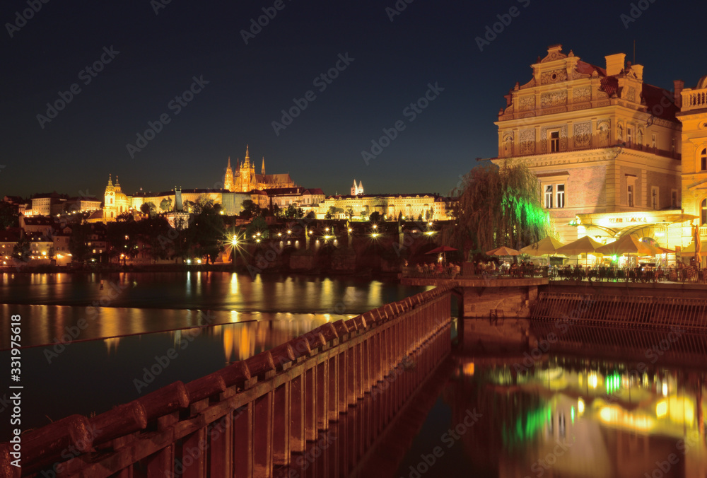 Lightened Prague castle with river at night