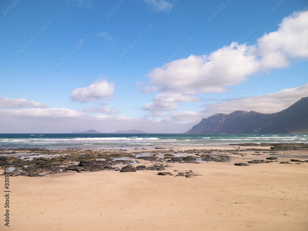 Beach and mountains - beautiful coast in Caleta de Famara, Lanzarote Canary Islands.