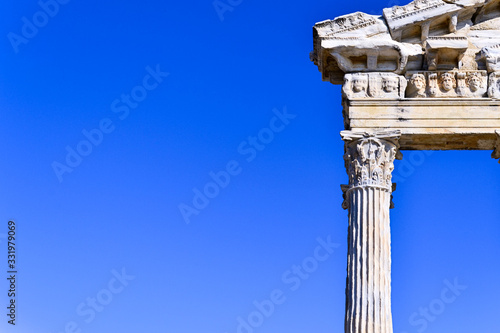 antique columns in the old city of Side against the blue sky in Turkey, background for a copy of the space