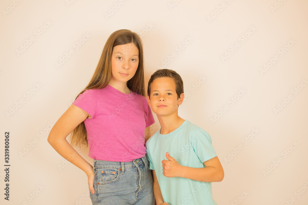 Beautiful boy and girl looking into camera Beautiful boy and girl looking into camera