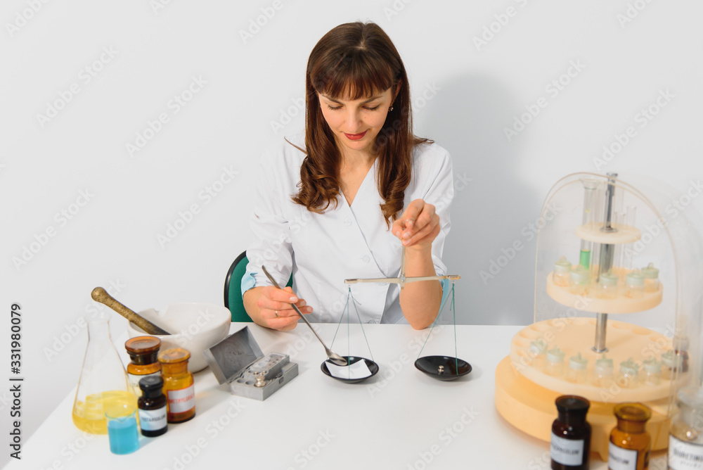 Scientists are pouring medicine from capsules in a medicine grinding cup on white isolate background, Scientists are pouring medicine from capsules in a medicine grinding cup on white isolate background,