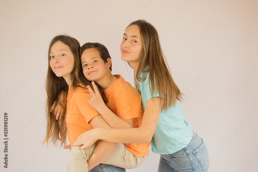 Boy and girls are looking into the camera Boy and girls are looking into the camera