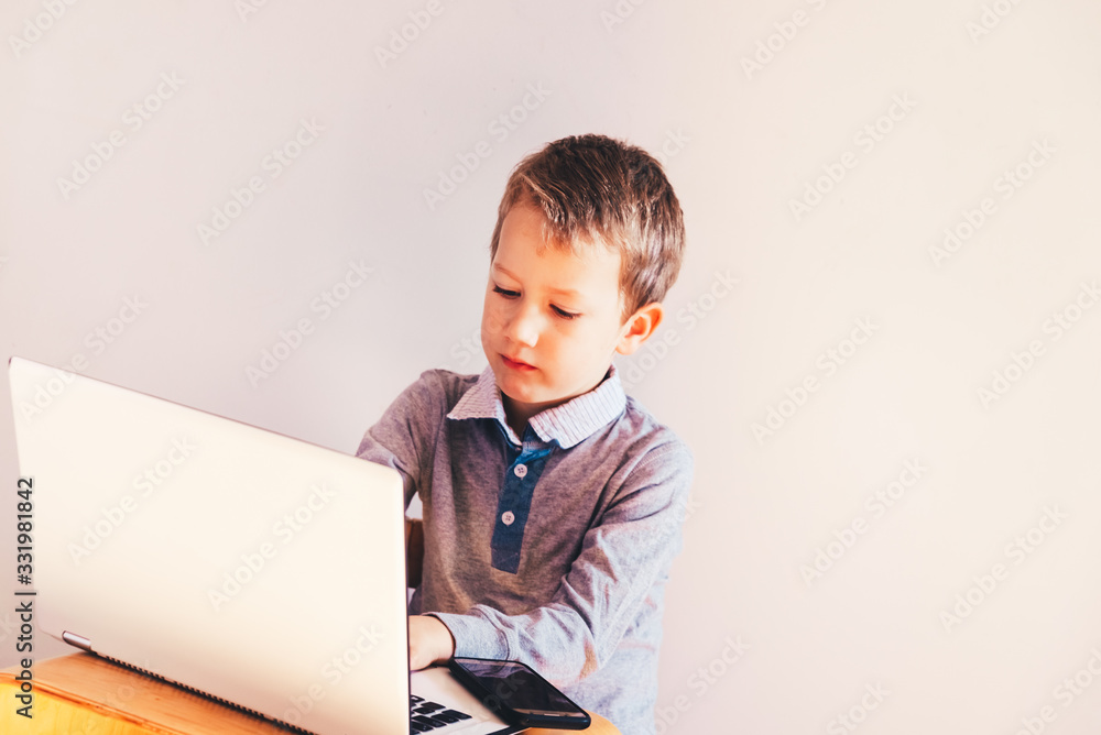 Child working with his computer in his business, concentrated typing to succeed, funny image. Child working with his computer in his business, concentrated typing to succeed, funny image.