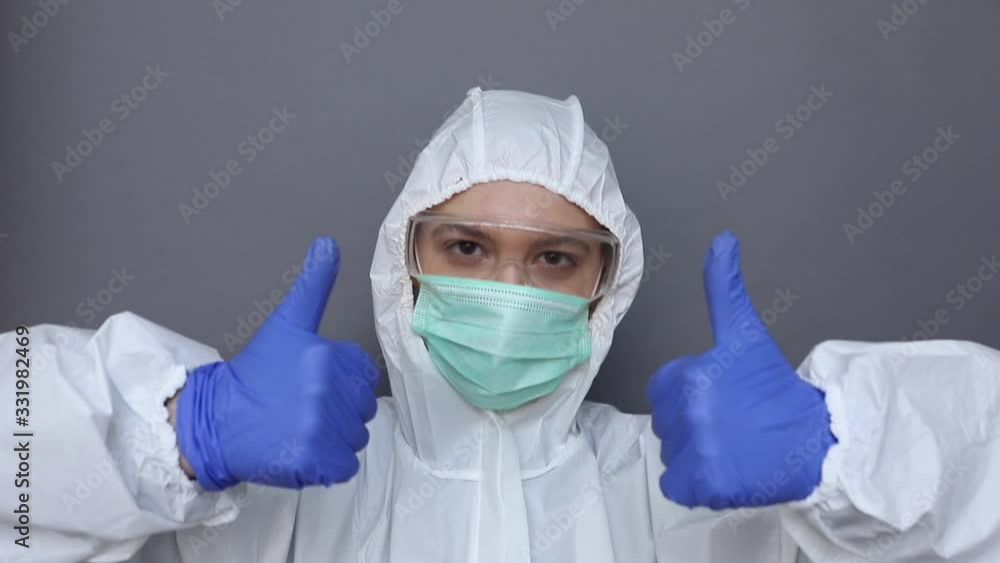 Woman in protective costume shows like sign Woman in protective costume shows like sign