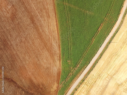 Aerial image taken with drone of crops one with plants, with exposed soil and no-till soil