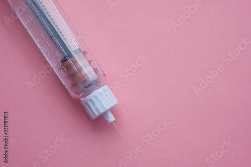insulin injection pen on color background 