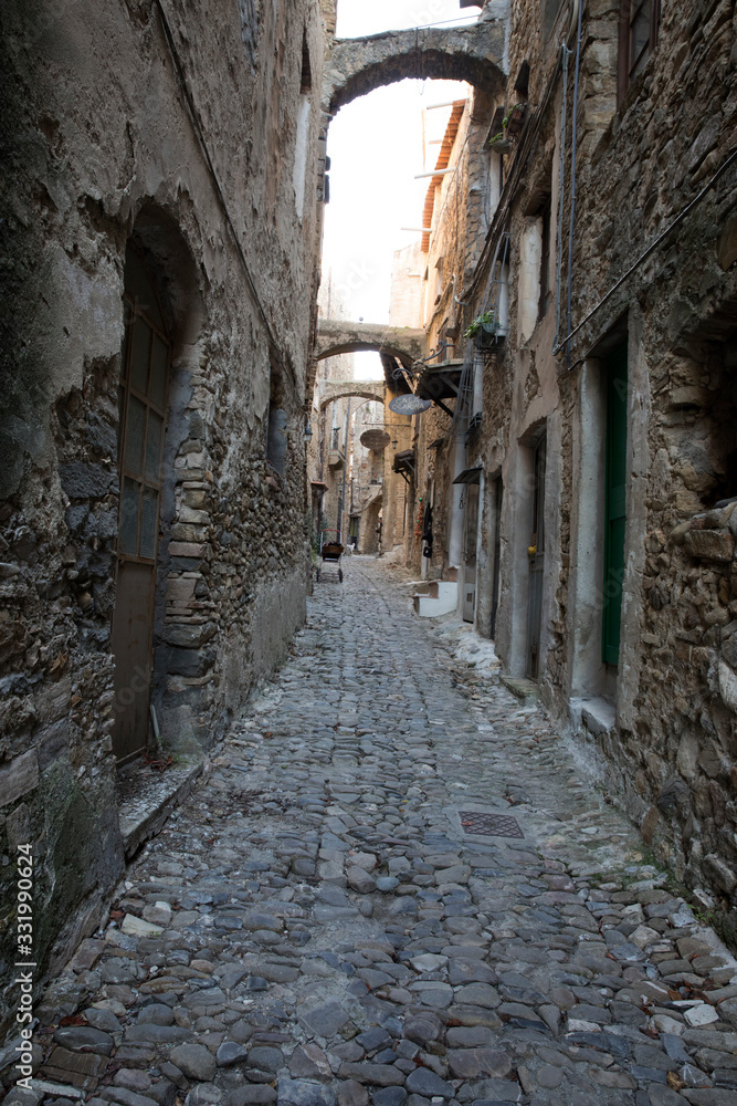 Bussana Vecchia (IM), Italy - December 12, 2017: A typical house and pathway in Bussana Vecchia, Imperia, Liguria, Italy